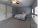 Comfortable bedroom showcasing plush carpeting and a well-placed ceiling fan at 3437 Coronet Ave, Orlando, FL 32833