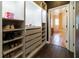 Walk-in closet with built-in shelving and drawers, connecting to the bathroom at 3437 Coronet Ave, Orlando, FL 32833