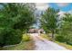 Lovely home with tile roof, arched entry, circular driveway, and mature trees at 3437 Coronet Ave, Orlando, FL 32833