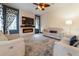 This spacious living room features a stacked stone fireplace and contemporary decor at 3437 Coronet Ave, Orlando, FL 32833