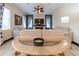 The bright living room features a stacked stone wall with an electric fireplace and contemporary decor at 3437 Coronet Ave, Orlando, FL 32833