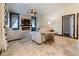 The bright living room features a stacked stone wall with an electric fireplace and contemporary decor at 3437 Coronet Ave, Orlando, FL 32833