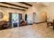 An expansive living room offers dark-stained wood flooring, ample space, and natural light with outdoor access at 3437 Coronet Ave, Orlando, FL 32833