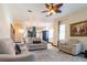 Bright living room with comfortable seating, stylish decor, and a glimpse into the kitchen for entertaining at 3437 Coronet Ave, Orlando, FL 32833