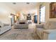 Spacious living room showcasing comfortable seating and an open layout leading to the well-equipped kitchen at 3437 Coronet Ave, Orlando, FL 32833