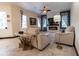 This spacious living room features a stacked stone fireplace, contemporary decor, and high ceilings at 3437 Coronet Ave, Orlando, FL 32833