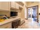 Bright office featuring built in desk, drawers and chair in neutral tones and hard flooring at 3437 Coronet Ave, Orlando, FL 32833