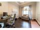 Bright office featuring hardwood floors, large windows and comfortable seating with natural lighting at 3437 Coronet Ave, Orlando, FL 32833