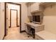 Well-lit office with built-in desk, drawers and chair in neutral tones with tile flooring at 3437 Coronet Ave, Orlando, FL 32833