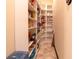 A spacious walk-in pantry offering plenty of shelving for organized storage at 3437 Coronet Ave, Orlando, FL 32833