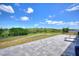 Enjoy serene backyard views with a spacious patio, great for relaxing and entertaining with calming scenery at 423 Pine Tree Blvd, Lake Alfred, FL 33850