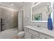 Well lit bathroom with vanity, bathtub and shower at 423 Pine Tree Blvd, Lake Alfred, FL 33850