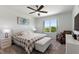 Bright bedroom featuring a cozy bed, window with views, and soft carpet at 423 Pine Tree Blvd, Lake Alfred, FL 33850