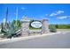 Community entrance sign to Lake Alfred Pines under a bright blue sky at 423 Pine Tree Blvd, Lake Alfred, FL 33850