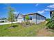 Attractive single-story home featuring a two-car garage and well-maintained landscaping with lush grass at 423 Pine Tree Blvd, Lake Alfred, FL 33850