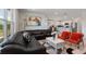 Open-concept living space with modern decor and views to the adjacent kitchen at 423 Pine Tree Blvd, Lake Alfred, FL 33850
