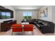 A modern living room features a large window and comfortable seating arrangements at 423 Pine Tree Blvd, Lake Alfred, FL 33850