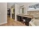 Bathroom featuring vanity with granite counters and stone surround tub at 434 S Beach St, Ormond Beach, FL 32174