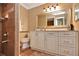 Comfortable bathroom featuring stylish vanity with a large mirror and tiled shower with safety bar at 434 S Beach St, Ormond Beach, FL 32174