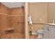 Bathroom showcasing a tile shower with a built-in bench and support bar for accessibility at 434 S Beach St, Ormond Beach, FL 32174