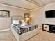 Bedroom with neutral decor, and a large bed at 434 S Beach St, Ormond Beach, FL 32174