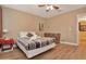 Bedroom with wood floors, ceiling fan and door to adjoining space at 434 S Beach St, Ormond Beach, FL 32174