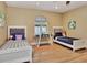 Bedroom with two beds and a glass top desk between them at 434 S Beach St, Ormond Beach, FL 32174