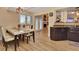 Bright dining area with table, adjacent kitchen, and access to outdoor patio through glass doors at 434 S Beach St, Ormond Beach, FL 32174