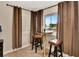 Cozy dining area featuring seating for two and a view through shuttered windows at 434 S Beach St, Ormond Beach, FL 32174