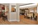 Open dining area featuring light wood flooring and neutral walls that connect with the updated kitchen at 434 S Beach St, Ormond Beach, FL 32174