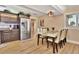 Well-lit dining area with modern table set adjacent to a kitchen with stainless steel appliances at 434 S Beach St, Ormond Beach, FL 32174