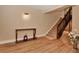 Entryway showcasing hardwood floors, console table, and staircase leading to the upper level at 434 S Beach St, Ormond Beach, FL 32174