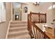 Carpeted staircase with decorative wooden railing leads to the upper level of the home at 434 S Beach St, Ormond Beach, FL 32174