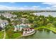 Overhead view showcases the community pool, gazebo, and lakefront amenities with beautiful landscaping at 4474 Enders St, Orlando, FL 32814