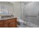 Modern bathroom with glass-enclosed shower and granite vanity at 4474 Enders St, Orlando, FL 32814