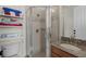 Bathroom featuring glass enclosed shower, decorative tile and granite countertop with undermount sink at 4474 Enders St, Orlando, FL 32814