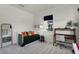 Neutral bedroom with daybed, desk area, and plenty of natural light at 4474 Enders St, Orlando, FL 32814
