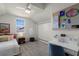 Upstairs bedroom with sloped ceilings, desk, and fun decorations at 4474 Enders St, Orlando, FL 32814