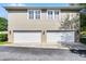 Spacious two-car garage with white doors and exterior lighting at 4474 Enders St, Orlando, FL 32814