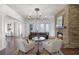 Cozy living room with a stone fireplace, plush seating, and French doors at 4474 Enders St, Orlando, FL 32814