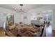 Open-concept living space boasts hardwood floors and seamless flow into kitchen and dining area at 4474 Enders St, Orlando, FL 32814