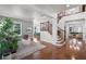 Bright living room with hardwood floors, a staircase, and large windows providing ample natural light at 4474 Enders St, Orlando, FL 32814