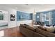 Spacious living room features blue accent wall, hardwood floors, and dining area at 4474 Enders St, Orlando, FL 32814