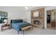 Main bedroom featuring a stone fireplace and tray ceiling at 4474 Enders St, Orlando, FL 32814