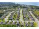 Aerial view of a residential neighborhood with green lawns, mature trees, and well-maintained streets at 459 Millwood Pl, Winter Garden, FL 34787