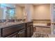 Elegant bathroom featuring a glass enclosed shower, tub with a decorative tile surround and double sinks at 459 Millwood Pl, Winter Garden, FL 34787