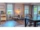 Living room/Dining Room features decorative rug, hardwood floors, and plenty of natural light at 459 Millwood Pl, Winter Garden, FL 34787