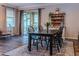 Cozy dining area featuring a wooden table, chairs and sliding glass doors at 459 Millwood Pl, Winter Garden, FL 34787