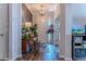 Inviting entryway with wood floors, piano, and coat rack, offering a warm welcome at 459 Millwood Pl, Winter Garden, FL 34787