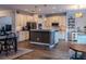 Spacious kitchen with a central island, white cabinets, and modern appliances at 459 Millwood Pl, Winter Garden, FL 34787